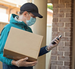 Contactless,delivery,during,covid 19,pandemic,lockdown,concept.,courier,wearing,mask